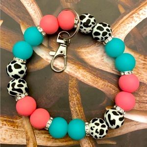 Cow print silicone wristlet